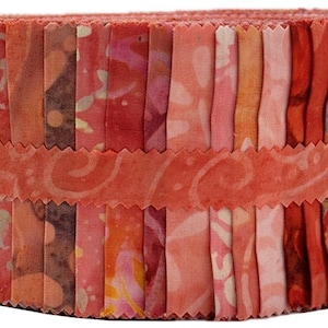 May include: A roll of fabric strips in shades of orange, pink, and brown. The fabric has a batik pattern and is perfect for quilting or crafting.