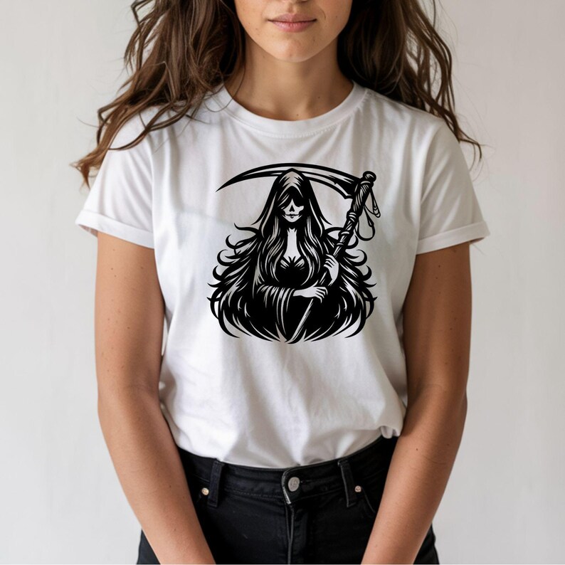 May include: White t-shirt featuring a black graphic of a Grim Reaper holding a scythe. The illustration depicts a hooded figure with long flowing hair. The shirt is a classic crew neck style.