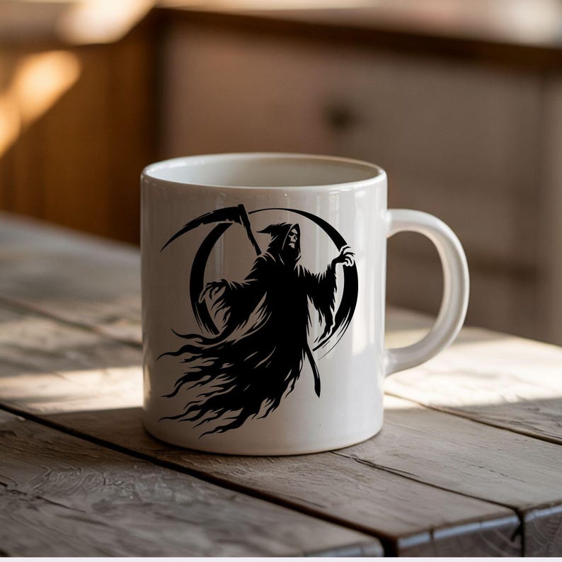 May include: White ceramic mug featuring a black graphic of the Grim Reaper with a scythe. The design is set against a black circular background. The mug has a curved handle and is placed on a wooden surface.