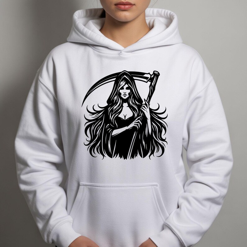 May include: White hooded sweatshirt featuring a black graphic of a female Grim Reaper holding a scythe. The illustration has long flowing hair and a hooded cloak. The design is centered on the front of the sweatshirt.