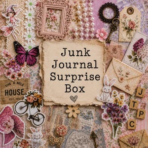 May include: A collage of vintage-style ephemera, including a framed floral print, paper tags, keys, and a decorative bicycle. The central element is a paper with the text "Junk Journal Surprise Box". A butterfly and flowers add color.