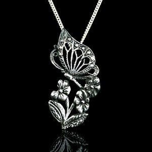 Flowers and Butterfly pendant ; Ezi Zino
