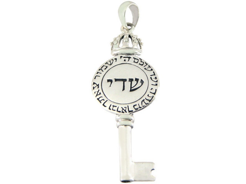 May include: Silver key pendant with a round charm featuring the Hebrew letter 'Shin' and the words 'Shema Yisrael' in Hebrew. The charm is topped with a crown.