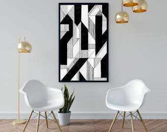 May include: Black and white geometric art print in a black frame. The artwork features abstract shapes and lines. The room includes two white chairs, a gold floor lamp, and hanging gold pendant lights. A potted plant sits between the chairs.