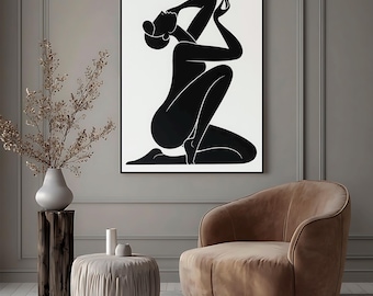 May include: A framed wall art print featuring a solid black silhouette of a kneeling figure with arms raised against a stark white background. The figure is depicted in a stylized, abstract form with smooth, curved lines and no facial features.