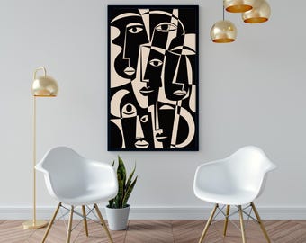 May include: Black and cream-colored abstract art print featuring multiple stylized faces. The artwork is framed in black and hangs on a white wall. The room includes white chairs, a gold floor lamp, and gold pendant lights.