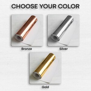 May include: The image displays three rolls of metallic foil in bronze, silver, and gold. Each roll is presented on a white surface, with the text "CHOOSE YOUR COLOR" at the top. The colors are labeled as "Bronze", "Silver", and "Gold" below each roll.