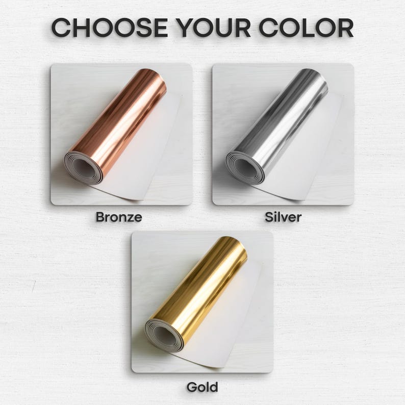 May include: The image displays three rolls of metallic foil in bronze, silver, and gold. Each roll is presented on a white surface, with the text "CHOOSE YOUR COLOR" at the top. The colors are labeled as "Bronze", "Silver", and "Gold" below each roll.