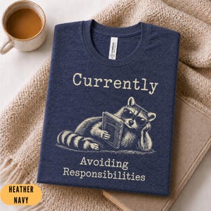 Currently Avoiding Responsibilities Shirt Funny Reading Raccoon Tee Book Lover Graphic Shirt Bookworm Gift Booktok Tee