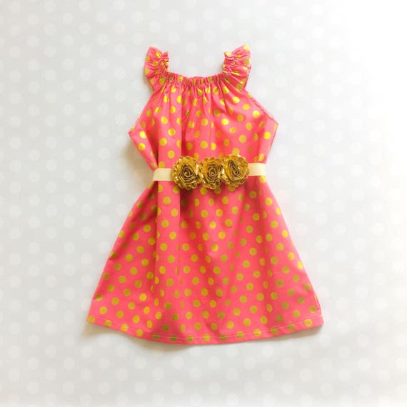 pink dress with gold polka dots