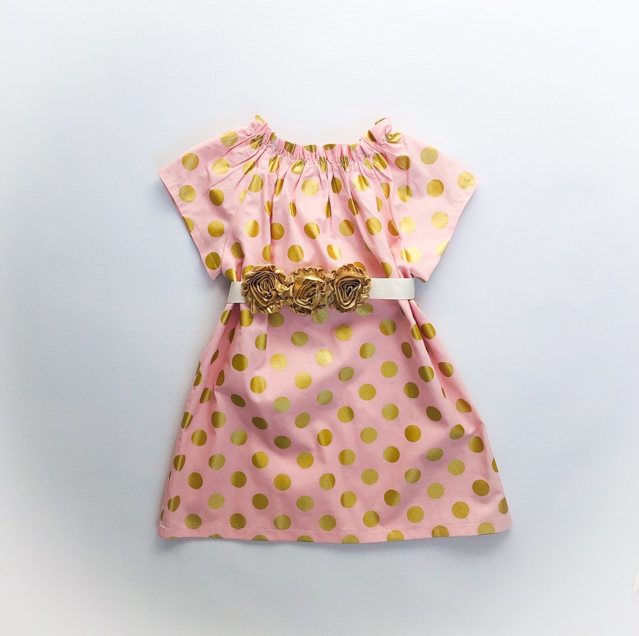 pink dress with gold polka dots