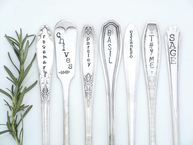 May include: Set of eight silver spoons with engraved names of herbs: Rosemary, Chives, Parsley, Basil, Cilantro, Thyme, and Sage.
