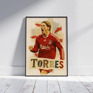 Pode incluir: Impressão artística emoldurada com uma ilustração estilizada de um jogador de futebol com uma camisa vermelha celebrando. A palavra "TORRES" é exibida em destaque. O fundo apresenta detalhes em vermelho.