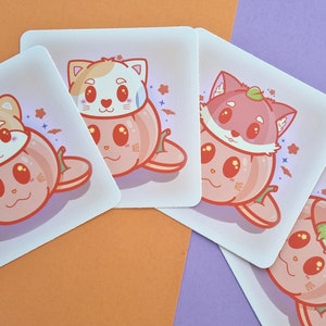 May include: Four illustrated stickers featuring a variety of animals peeking out of pumpkins. The stickers are on a light purple and orange background.