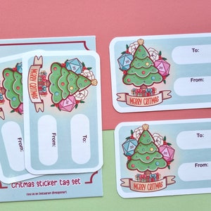 May include: A set of four Christmas gift tags featuring a cartoon illustration of a Christmas tree decorated with dice and the text "Merry Critmas". Each tag has space for writing "To:" and "From:".