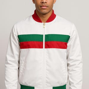 May include: White bomber jacket with a red collar and green and red stripe across the chest. The jacket has a zipper closure and green ribbed cuffs and hem. A stylish outerwear piece.