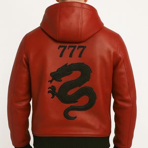May include: Red leather jacket with a black dragon design and the number 777 on the back. The jacket has a hood and black ribbed cuffs and hem. A stylish outerwear piece.