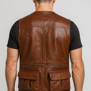 Brown Leather Utility Vest The Rugged Explorer's Vest Stylish Multi-Pocket Vest Adventure-Ready Leather Vest The Modern Hunter's Attire Men's Photography Vest with Pockets Authentic Leather Vest for Men Timeless Appeal: The Man and His Leather Vest The Vest Defined: Style Meets Durability Tactical outdoor vest Vintage leather vest Biker style vest Travel gear vest Workwear utility vest Hunter fishing vest Real leather vest Functional fashion vest Men’s cargo vest Durable field vest
