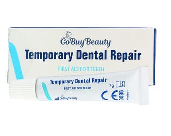 May include: A white tube of "Temporary Dental Repair" with a blue and white box. The box and tube both display the text "Go Buy Beauty" and "FIRST AID FOR TEETH". The tube contains 7g of product.
