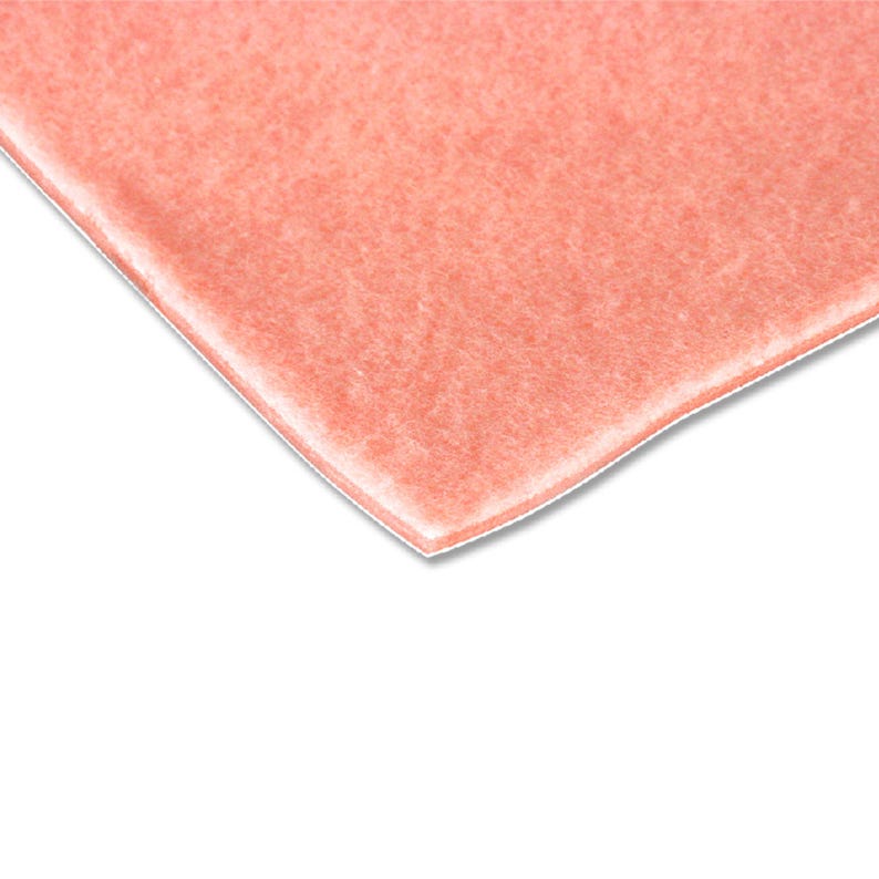 Peel-back view showing self-adhesive layer of Fleecy Web Extra pad
