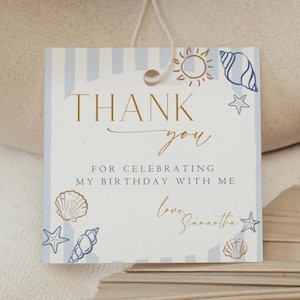 May include: A square gift tag with a beach theme. The tag has blue and white stripes and features the words "THANK YOU" in gold script. It includes seashell and starfish illustrations and the text "FOR CELEBRATING MY BIRTHDAY WITH ME" and "love, Samantha."
