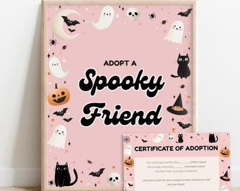 May include: A framed pink Halloween-themed print with the words "Adopt a Spooky Friend." The print features illustrations of ghosts, bats, pumpkins, spiders, and black cats. A smaller certificate of adoption is included.