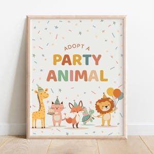 May include: A framed print with the text "Adopt a Party Animal" and illustrations of a giraffe, cat, fox, turtle, and lion, all wearing party hats and holding balloons and a cake. The background is white with confetti and star accents.