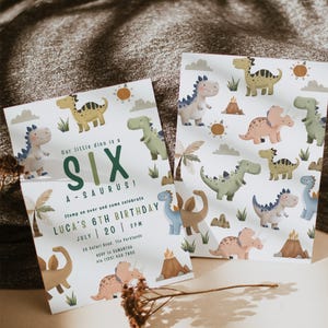 May include: Two birthday invitations with a dinosaur theme. The invitations feature illustrations of various dinosaurs, suns, and clouds. Text on the invitations reads "Our little dino is a SIX A-SAURUS!" and "LUCA'S 6TH BIRTHDAY JULY 20 2PM".