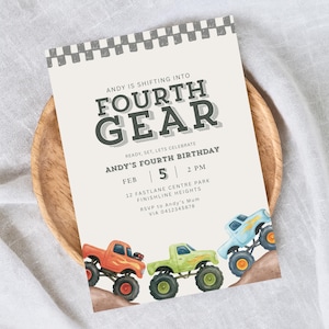 May include: A birthday invitation with the text "ANDY IS SHIFTING INTO FOURTH GEAR". The invitation features illustrations of three monster trucks in orange, green, and blue. The invitation also includes the date, time, and location of the birthday party.