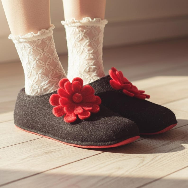 Coquette aesthetic wool slippers for women, black with red felt flower, paired with white lace socks for a feminine romantic vibe. Soft felt house shoes prevent cold feet and make a thoughtful gift for wife or girlfriend.