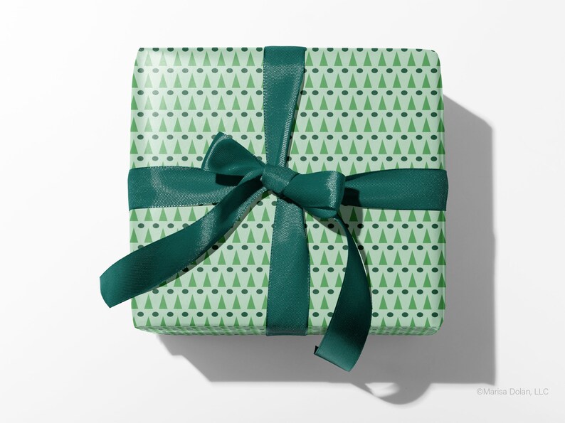 Christmas gift wrapped with green, modern geometric wrapping paper by Marisa Dolan