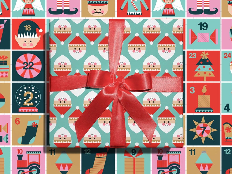 Christmas gift wrapping paper with a modern, geometric Santa pattern design paired with a red ribbon by Gigglemugg