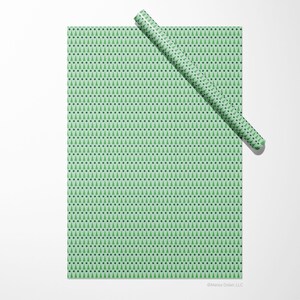 Christmas gift wrap sheet featuring green, modern geometric design by Marisa Dolan