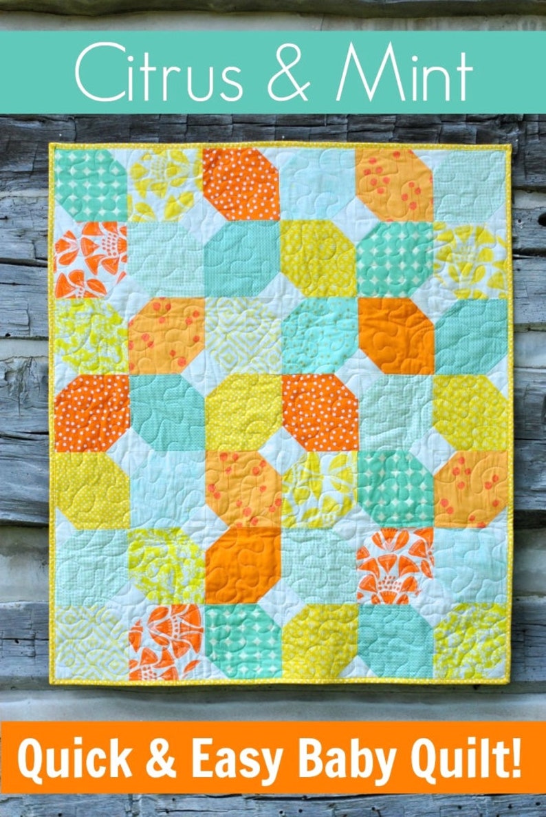 May include: A baby quilt with a patchwork design featuring yellow, orange, and turquoise squares. The quilt is made with a variety of fabrics with different patterns. The quilt is titled "Citrus & Mint" and "Quick & Easy Baby Quilt!"