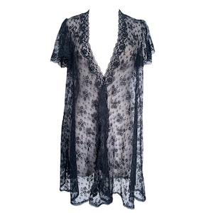 May include: Black lace robe with a V-neckline and short sleeves. The robe is made of delicate, sheer lace with a floral pattern.