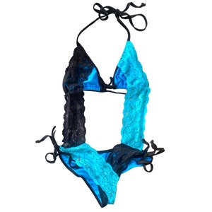 May include: A black and turquoise lace bikini with a halter top and a high-cut bottom.