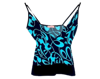 May include: A black and turquoise sleeveless top with a wrap style and a floral pattern.