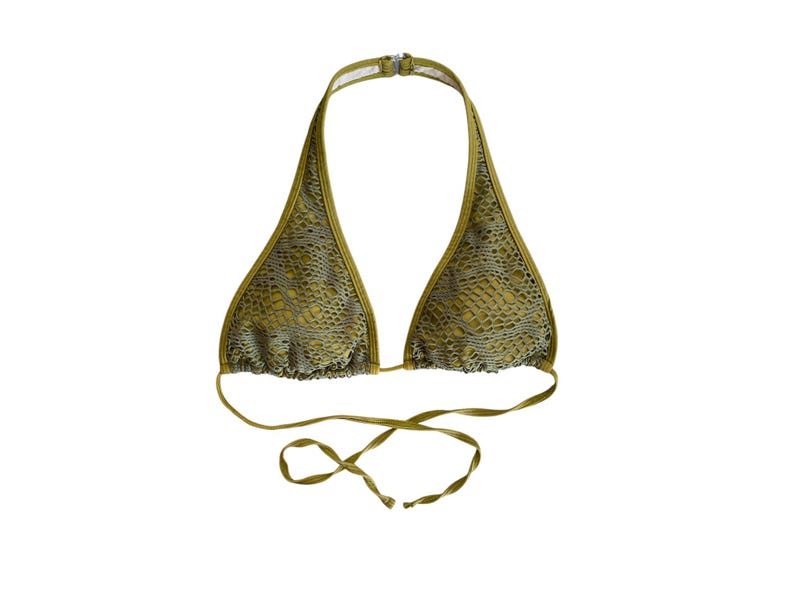 May include: A green halter bikini top with a snakeskin pattern.
