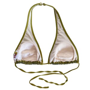 May include: A green halter bikini top with a ruffled trim. The top has a small embroidered logo on the left side.
