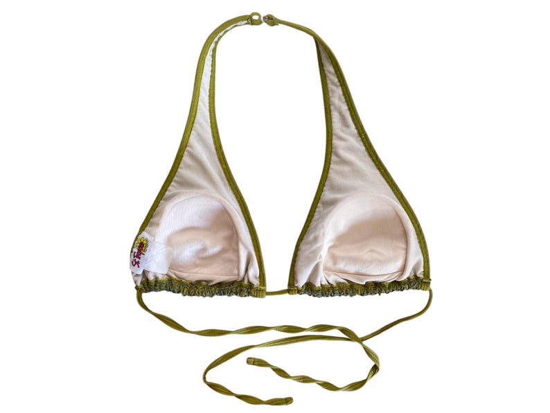 May include: A green halter bikini top with a ruffled trim. The top has a small embroidered logo on the left side.