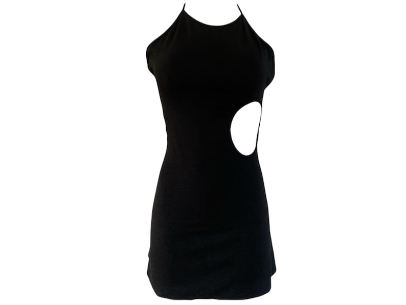 May include: A black halter dress with a cutout detail on the side. The dress is sleeveless and has a fitted silhouette. The cutout is a large, oval shape. The dress is made of a smooth, solid fabric.