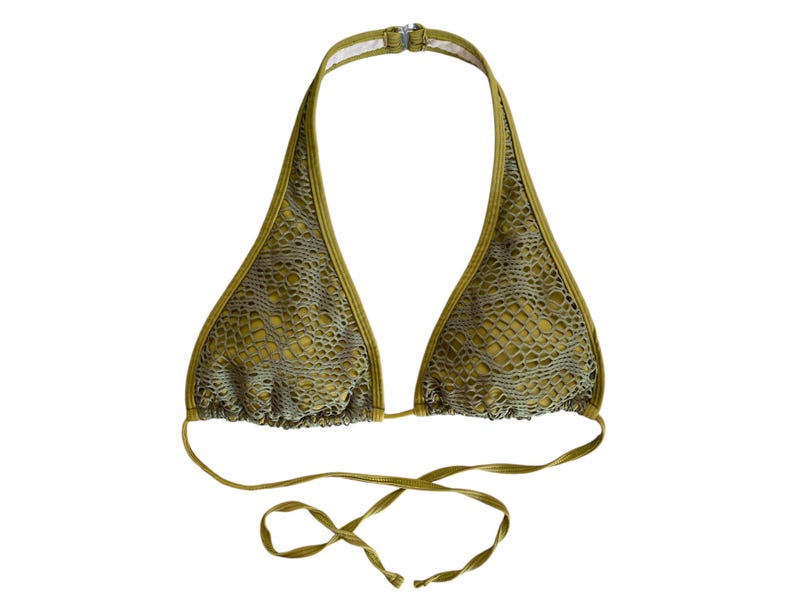 May include: A green halter-style bikini top with a mesh pattern. The top has adjustable straps and ties at the back.