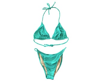 May include: A turquoise bikini with a triangle top and a high-cut bottom.