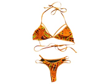May include: A two-piece swimsuit with a colorful patterned top and a solid black bottom. The top has a triangle shape and ties at the neck and back. The bottom is a high-cut style with ties on the sides.