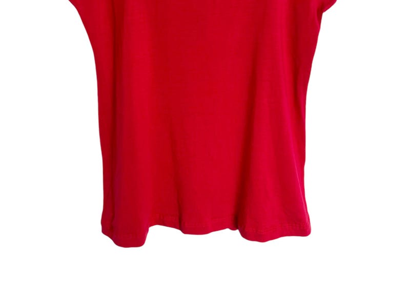 May include: A plain, bright red t-shirt with short sleeves and a scoop neck.