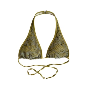 May include: A gold halter-style bikini top with a snakeskin pattern.