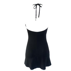 May include: A black halter dress with a flared hem. The dress features a halter neckline with tie straps. The back of the dress is visible, showcasing the open design. The dress is made of a smooth, solid fabric.