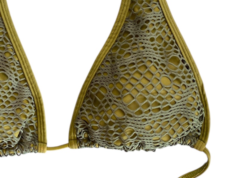 May include: A green mesh bikini top with a halter style and adjustable straps.