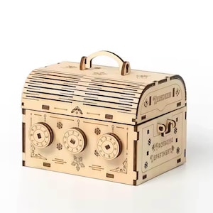May include: A light brown wooden chest with a handle, three combination dials, and snowflake and floral patterns. The text "REINDEER" and "PACKAGING DEPARTMENT" are visible on the chest.