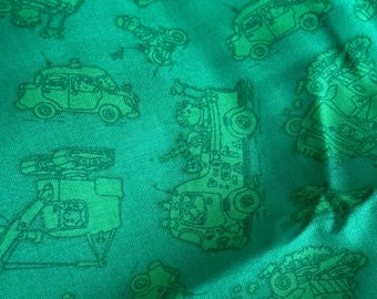May include: A vibrant green fabric featuring a repeating pattern of dark green line-art illustrations of various construction vehicles, including excavators, dump trucks, and cranes, printed across the textured surface of the material.